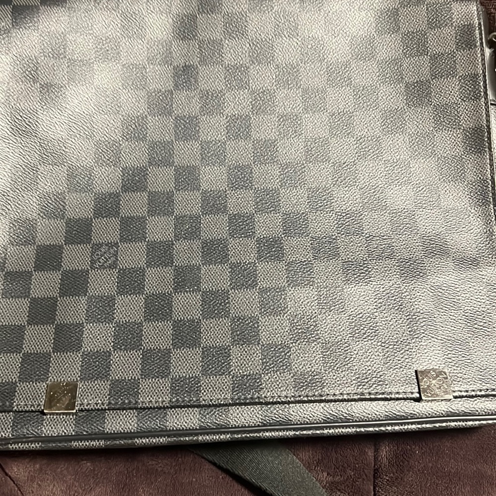 Louis Vuitton messenger bag.